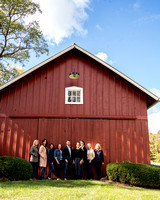 up against large red barn